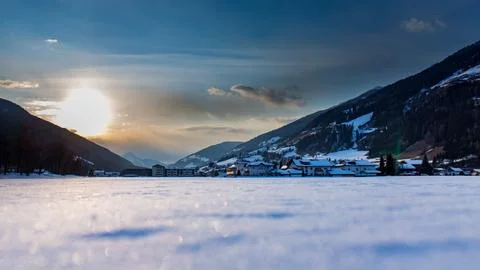 Sunset in valley with snow Foto stock