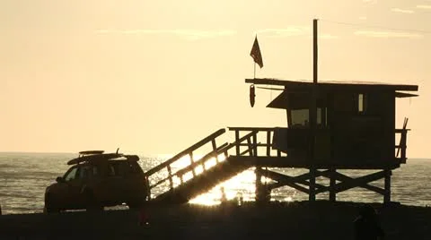 Sunset at Venice Beach in Slow Motion, Lifeguard tower and truck. 1 Stock Footage 19403087