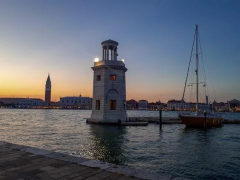 Sunset in venice with a lighthouse Stock Photos