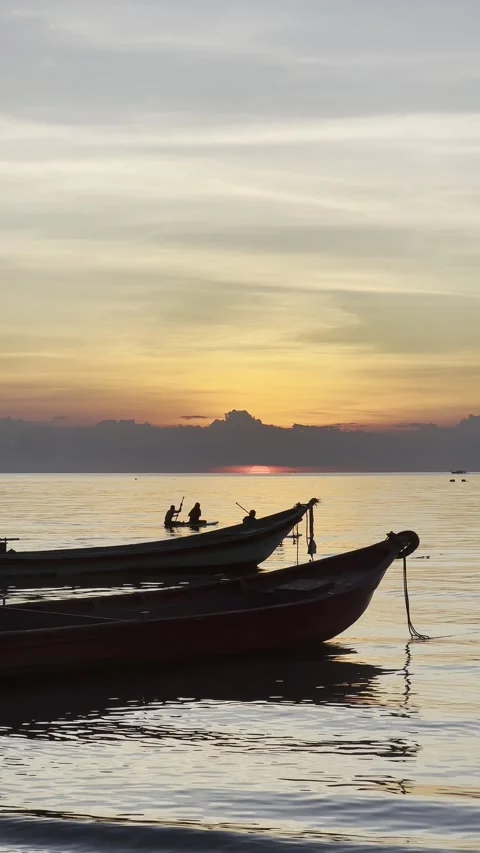 Sunset video at the beach with long tail boats Thailand Koh Tao cloudy sunset  Stock Footage 246353258
