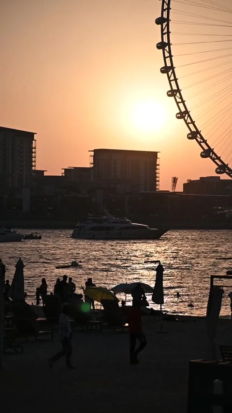 Sunset view of Ain Dubai Ferris wheel from Dubai Marina Stock Footage 309878270