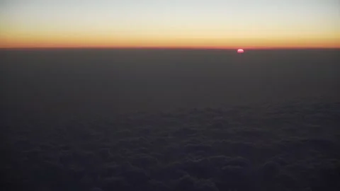 Sunset view from the airplane. Fly above the clouds. Stock Footage 157207033