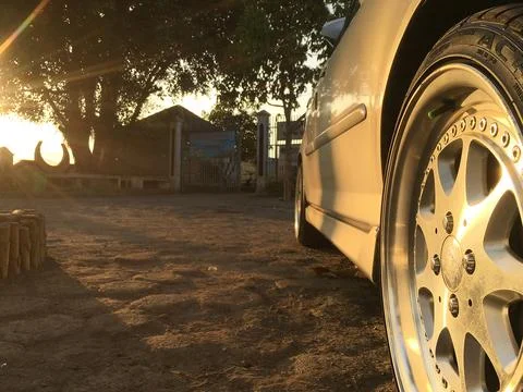 Sunset view and car Stock Photos