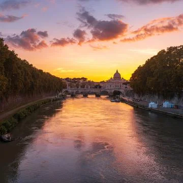 Sunset view of Basilica St Peter, bridge Sant Angelo in Rome. Italy. Stock Photos