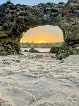 Sunset view from beach cave Stock Photos