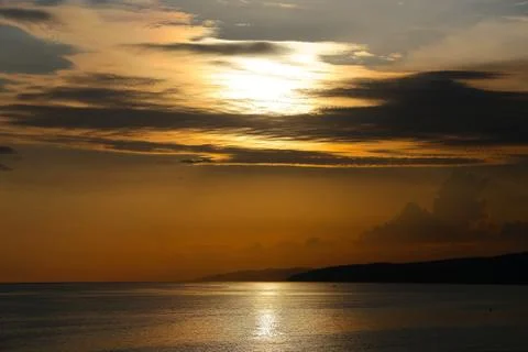 Sunset view on beach during summer time Stock Photos