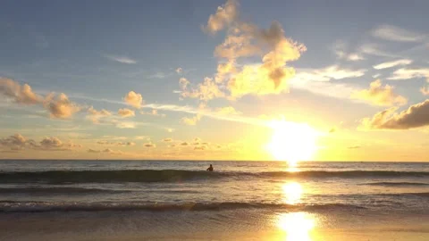 Sunset view beach sea sand sun water wave beautiful blue sky background Stock Footage 153378051