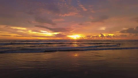 Sunset view on the beach side, beautiful orange and yellow sky 動画素材 300253875
