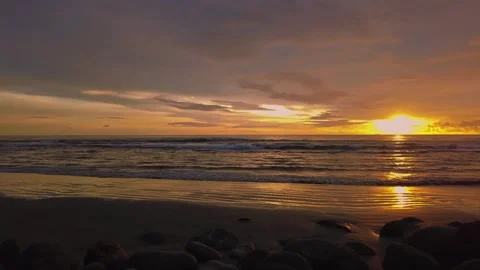 Sunset view on the beach side, beautiful orange and yellow sky 動画素材 300254127
