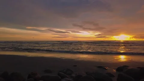 Sunset view on the beach side, beautiful orange and yellow sky 動画素材 300254133