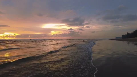 Sunset view on the beach side, beautiful orange and yellow sky 動画素材 300254158