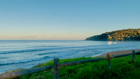 Sunset view on beach with waves in golden hour at Palm Beach, Sydney Australia Stock Footage 168921862
