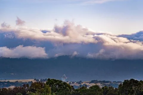 Sunset view of a blanket of clouds covering the forests of Santa Cruz Mount.. Stock Photos