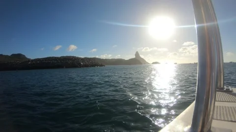Sunset view from a boat at Santo Antonio Harbor Beach in Fernando de Noronha Stock Footage 172337701