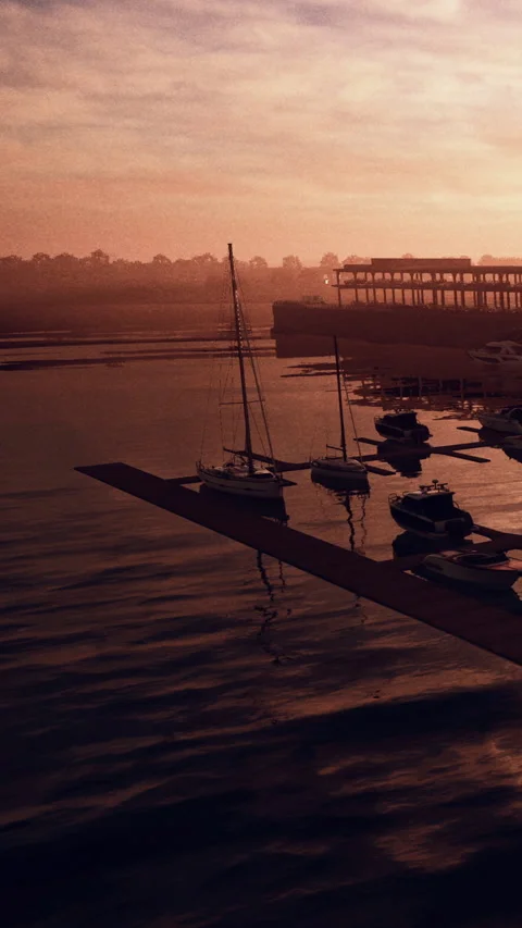 Sunset view of boats at dock with calm water in coastal area Stock Footage 340635469