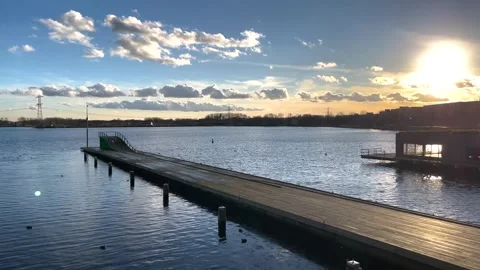 Sunset view of city waterfront with a long deck on the water,Almere,Netherlands 스톡 동영상 246057963