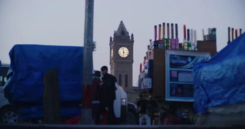 Sunset View Of The Clock Tower Between Street Vendor Shopping in Erbil, Iraq Stock Footage 150354668