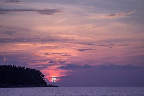 Sunset view with the cloud cover the sun on Kata Beach on Phuket island, Ph.. Stock Photos