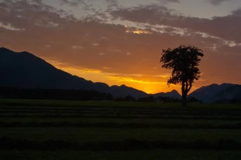 Sunset view with clouds over alps Stock Photos