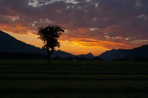 Sunset view with clouds over alps Stock Photos