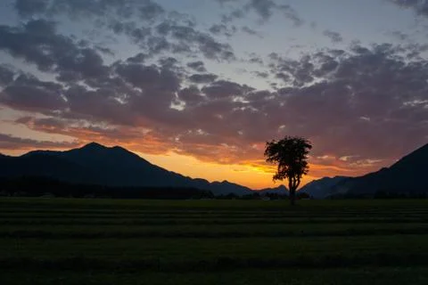 Sunset view with clouds over alps Stock Photos