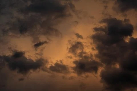 Sunset - view of cloudy sky at setting sun Stock Photos