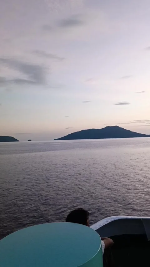 Sunset view from the deck of a ferry sailing Stock Footage 281390827