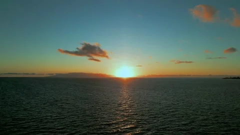 A sunset view from a drone flying at the sea Stock Footage 204893698