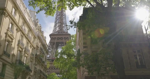 Sunset. View of the Eiffel Tower from one of the famous streets of Paris Stock Footage 247953054
