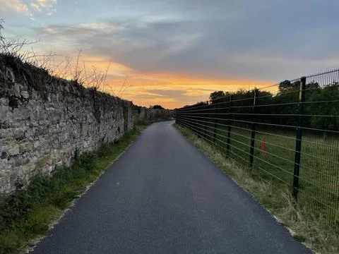 Sunset view at the end of pathway. 스톡 사진
