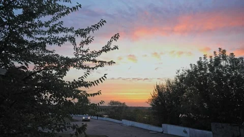 Sunset view of the evening in the city of beautiful colors in the sky Stock Footage 142809122