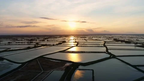 Sunset with a view of fish ponds and mountains, beautiful, aerial view Stock Footage 132950916