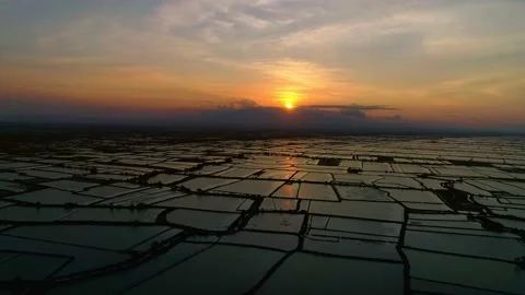 Sunset with a view of fish ponds and mountains, beautiful, aerial view Stock Footage 132950926
