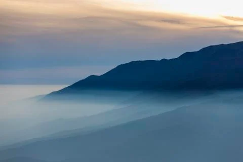 Sunset view with fog Stock Photos