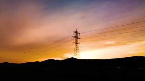 Sunset View of High Voltage Power Line Tower Stock Footage 339169237