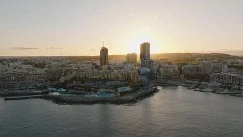 Sunset view of highest and modern building of Malta island. St. Julians city Stock Footage 268243669