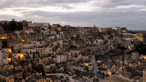 Sunset view of illuminated town roofs of matera,italy,night atmosphere timelapse Stock Footage 125364528