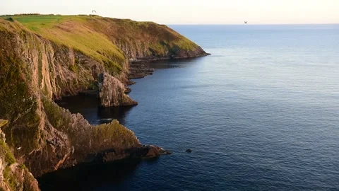 Sunset view of Irish cliffs nearby Downmacpatrick Castle, Kinsale, Cork, Ireland Stock Footage 154373491