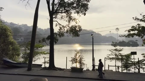 Sunset View of Kandy Lake With People Walking, Sri Lanka Video stock 331529846