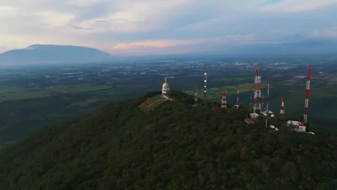 Sunset view of la Cumbre, Colima, Mexico with Chapel and Communication Stock Footage 291940233