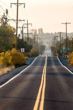 Sunset view of Lambert Road next to Smith Rock State Park in the background Stock Photos