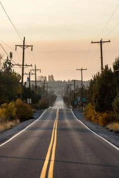 Sunset view of Lambert Road next to Smith Rock State Park in the background Stock Photos