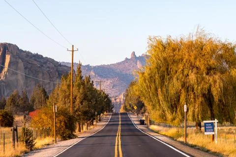 Sunset view of Lambert Road next to Smith Rock State Park in the background Stock Photos