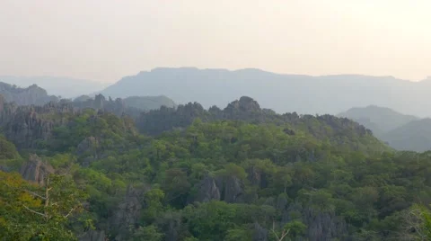 Sunset view landscape mountains and jungle, Laos. Long shot, telephoto lens. Stock Footage 65478647