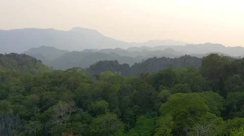 Sunset view, landscape, mountains, jungle, Laos. Telephoto lens, long shot, 4K Stock Footage 65708515
