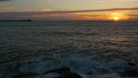 Sunset view of lighthouse at south pier Ijmuiden, The Netherlands Stock Footage 251632928