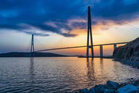 Sunset view of long cable-stayed bridge in Vladivostok, Far East of Russia Stock Photos