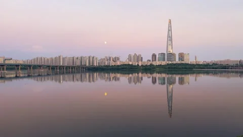 Sunset view of Lotte Tower in Seoul reflected on Han River Stock Footage 314126394