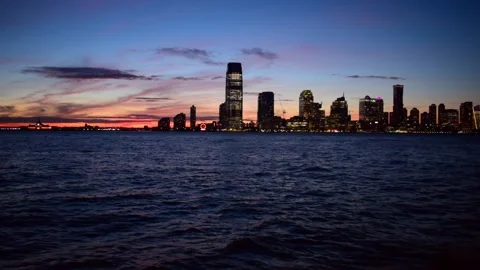 Sunset view from Manhattan, New York City: Hudson river and Jersey City skyline Stock Footage 130930707