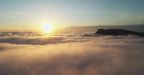 Sunset view from the mountain above clouds Stock Footage 167944599